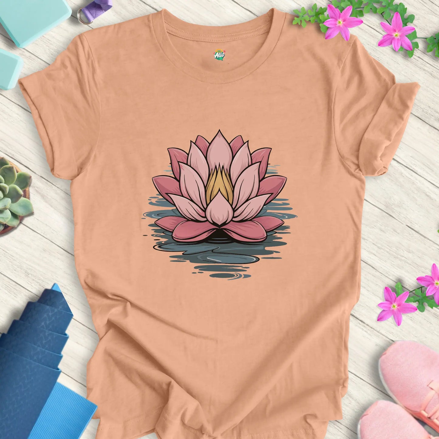 Heather Peach yoga t-shirt featuring a minimalist lotus flower design, perfect for meditation, by Halo Allo.