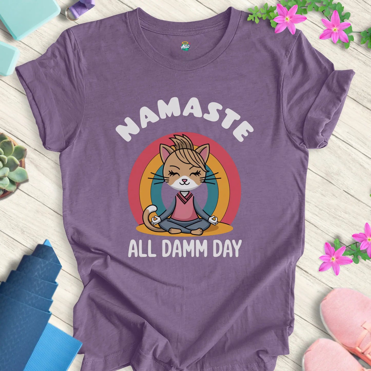 Heather Team Purple yoga t-shirt with 'Namaste All Damm Day' design featuring a meditative cat by Halo Allo. Perfect for spiritual practice and casual wear.