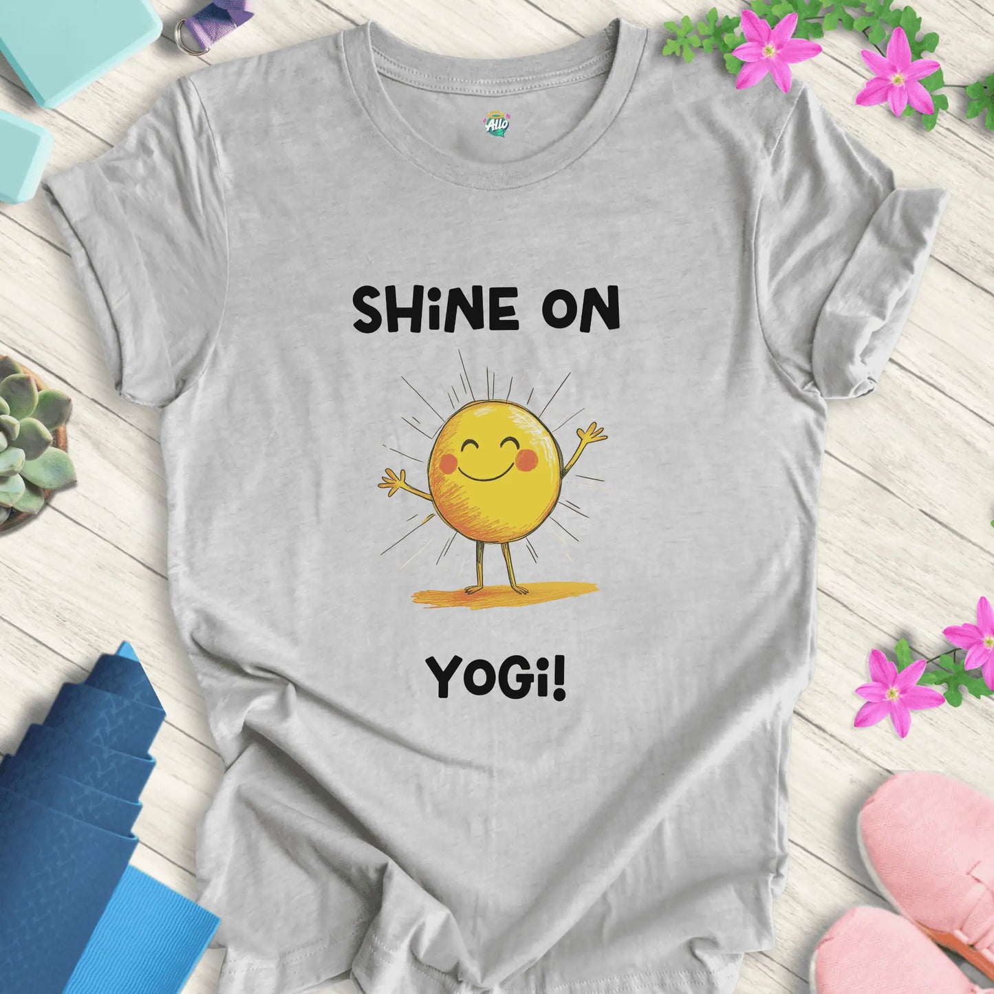 Athletic Heather yoga t-shirt with 'Shine On Yogi!' text and cheerful sun design by Halo Allo, perfect for meditation and spiritual wellness.