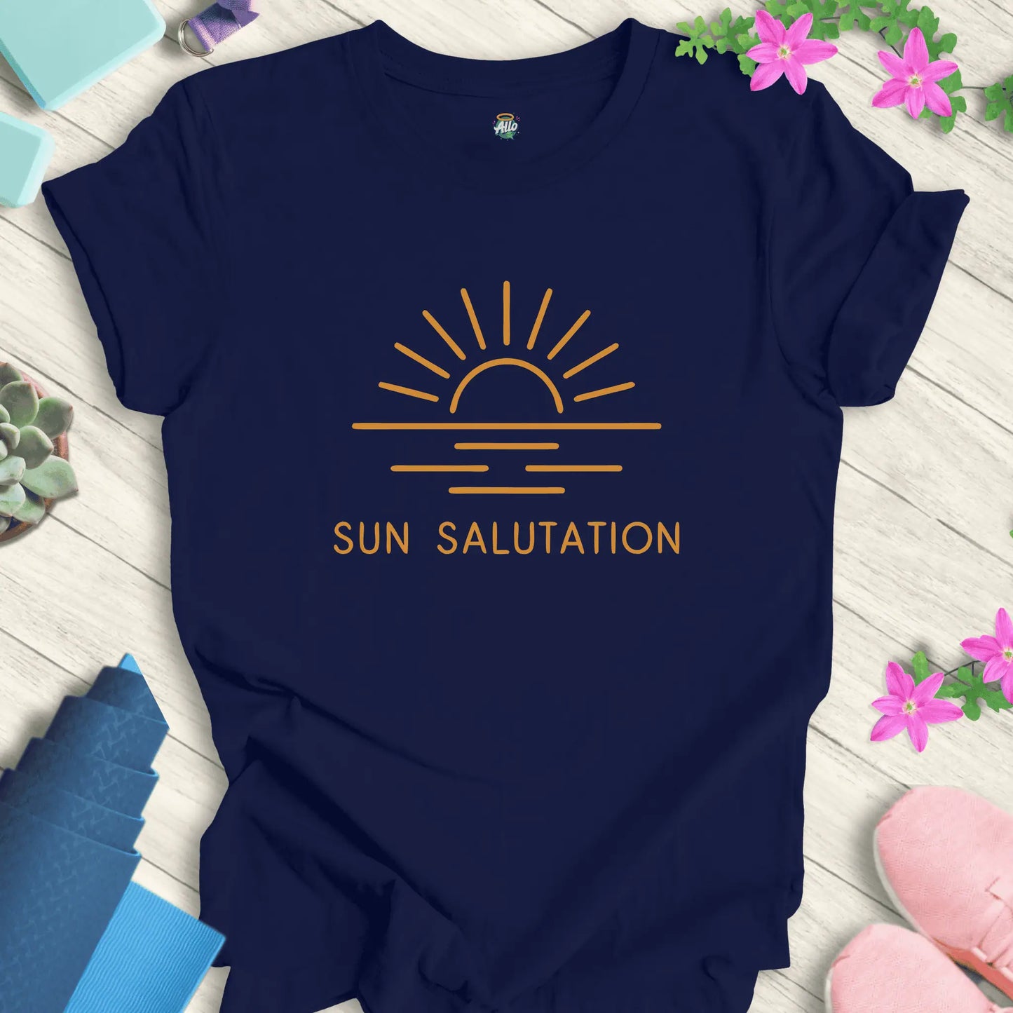 Navy yoga t-shirt with 'Sun Salutation' design by Halo Allo, featuring a sunrise motif. Perfect for meditation enthusiasts.