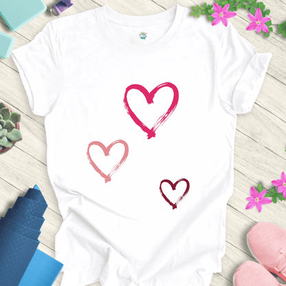 White yoga t-shirt with 'Halo Allo Love All Around' design, featuring three heart motifs, perfect for spiritual wellness.