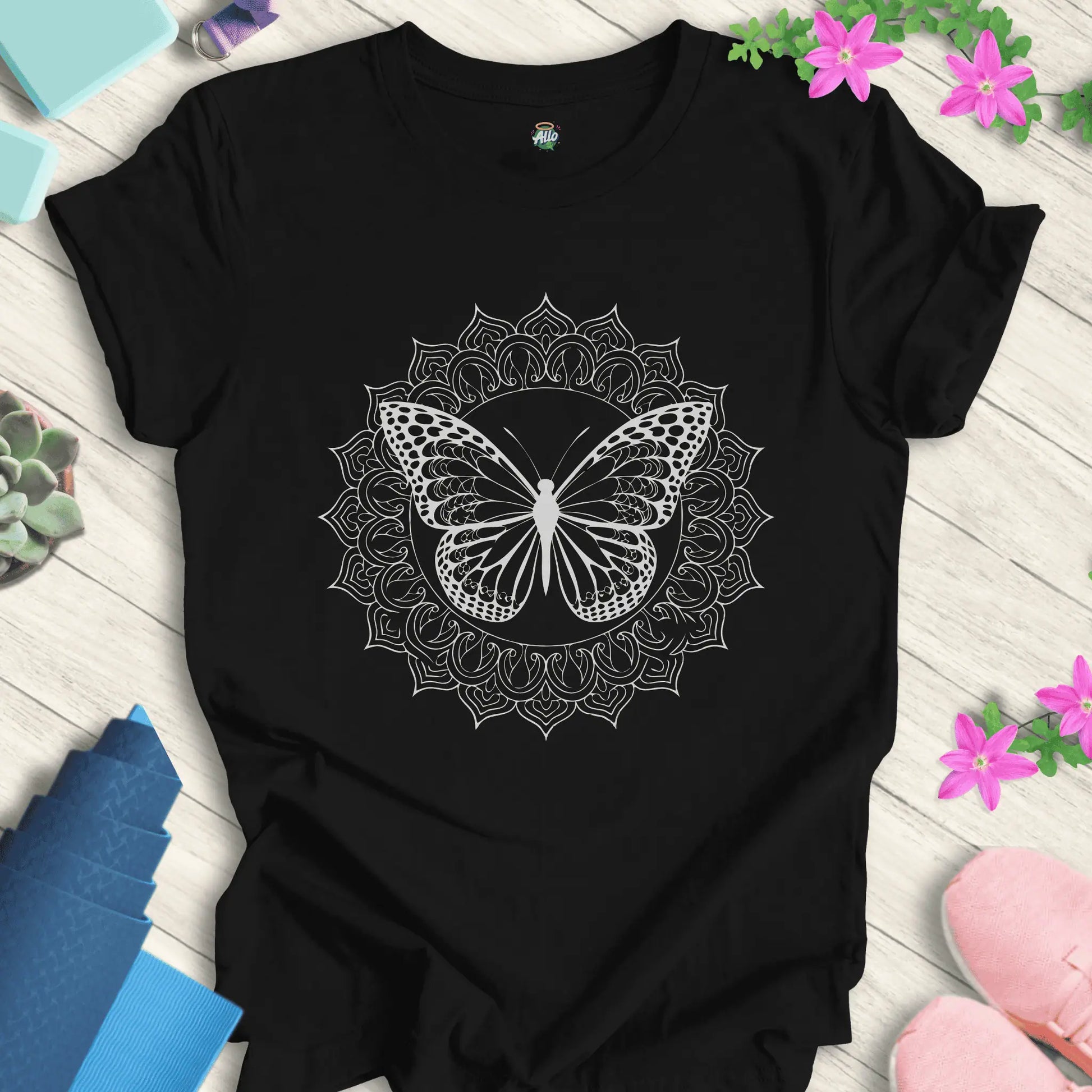 Black yoga t-shirt featuring a mandala butterfly design, perfect for meditation and everyday wear.