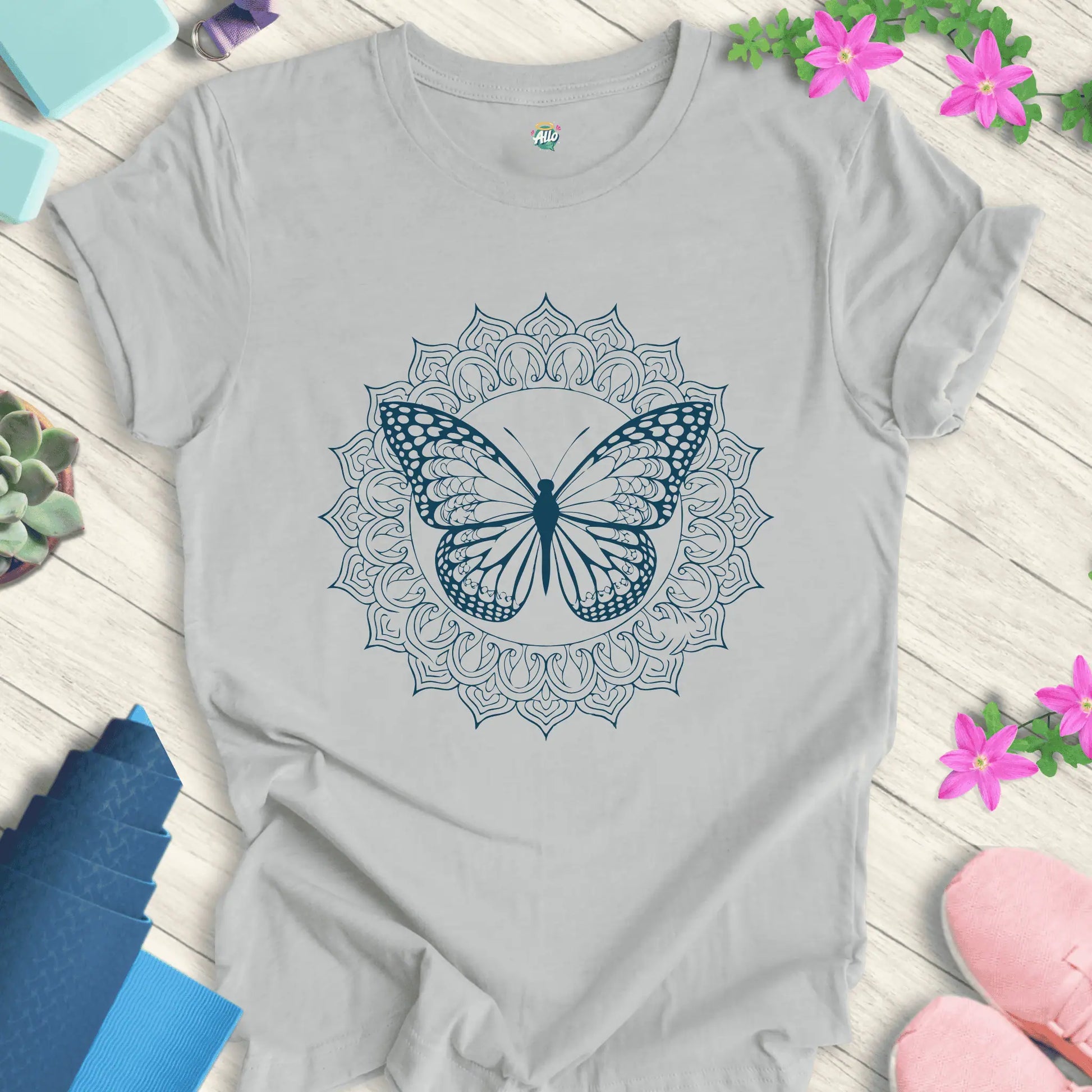 Silver yoga t-shirt featuring a mandala butterfly design, perfect for meditation and everyday wear.
