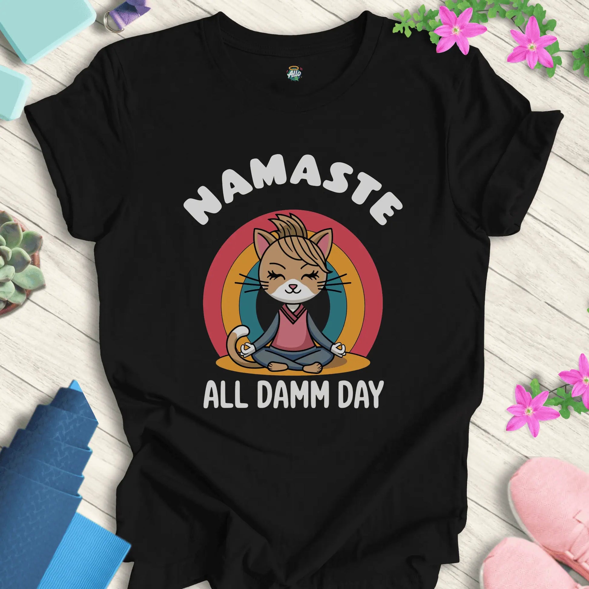 Black yoga t-shirt with 'Namaste All Damm Day' design featuring a meditative cat by Halo Allo. Perfect for spiritual practice and casual wear.