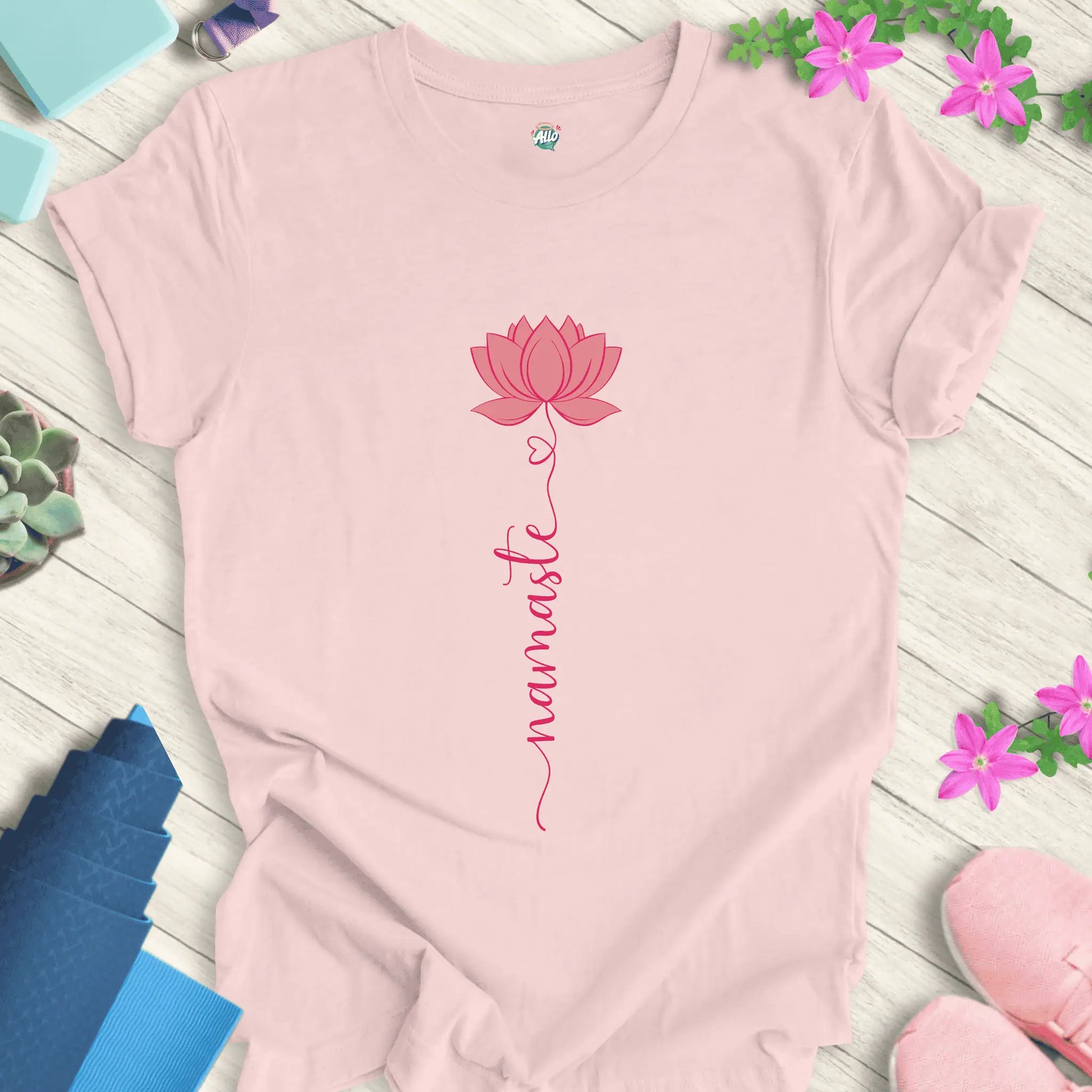 Soft Pink yoga t-shirt with 'Halo Allo Namaste Lotus Love' design, featuring a minimalist pink lotus flower and handwritten 'namaste' text.