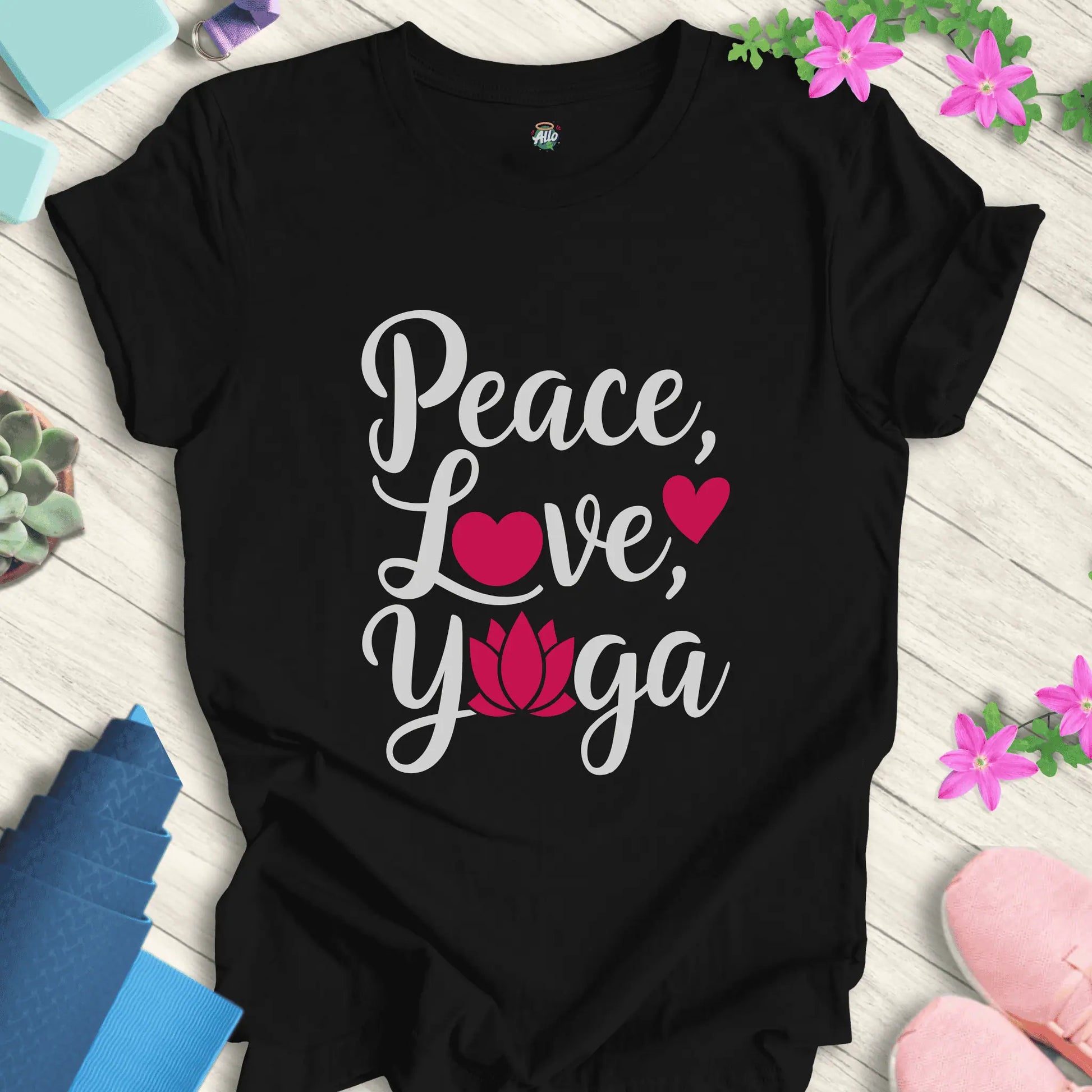 Black yoga t-shirt with 'Peace, Love, Yoga' design featuring a lotus flower and heart symbols, perfect for meditation and mindfulness.