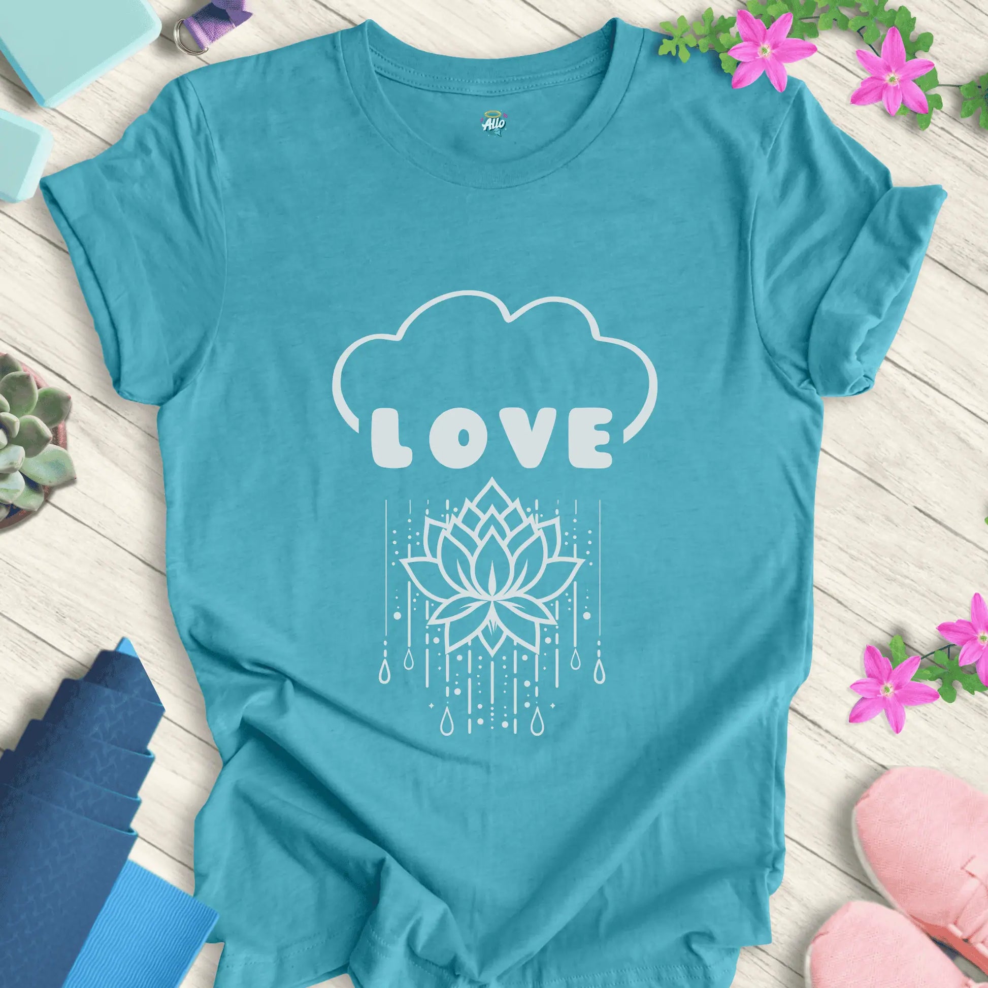 Heather Aqua yoga t-shirt with 'Rain Down Love' design featuring a lotus flower and cloud motif by Halo Allo.