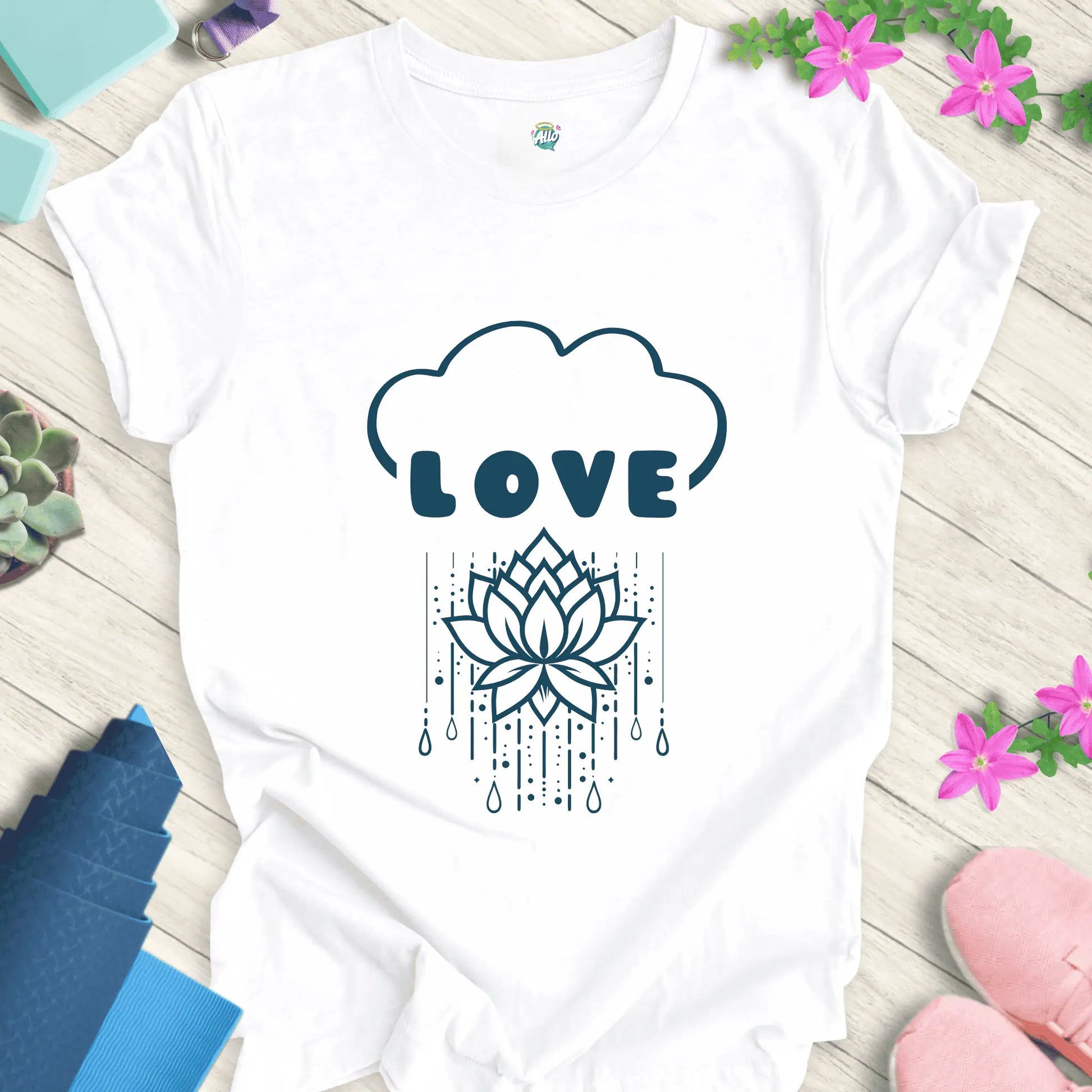 White yoga t-shirt with 'Rain Down Love' design featuring a lotus flower and cloud motif by Halo Allo.