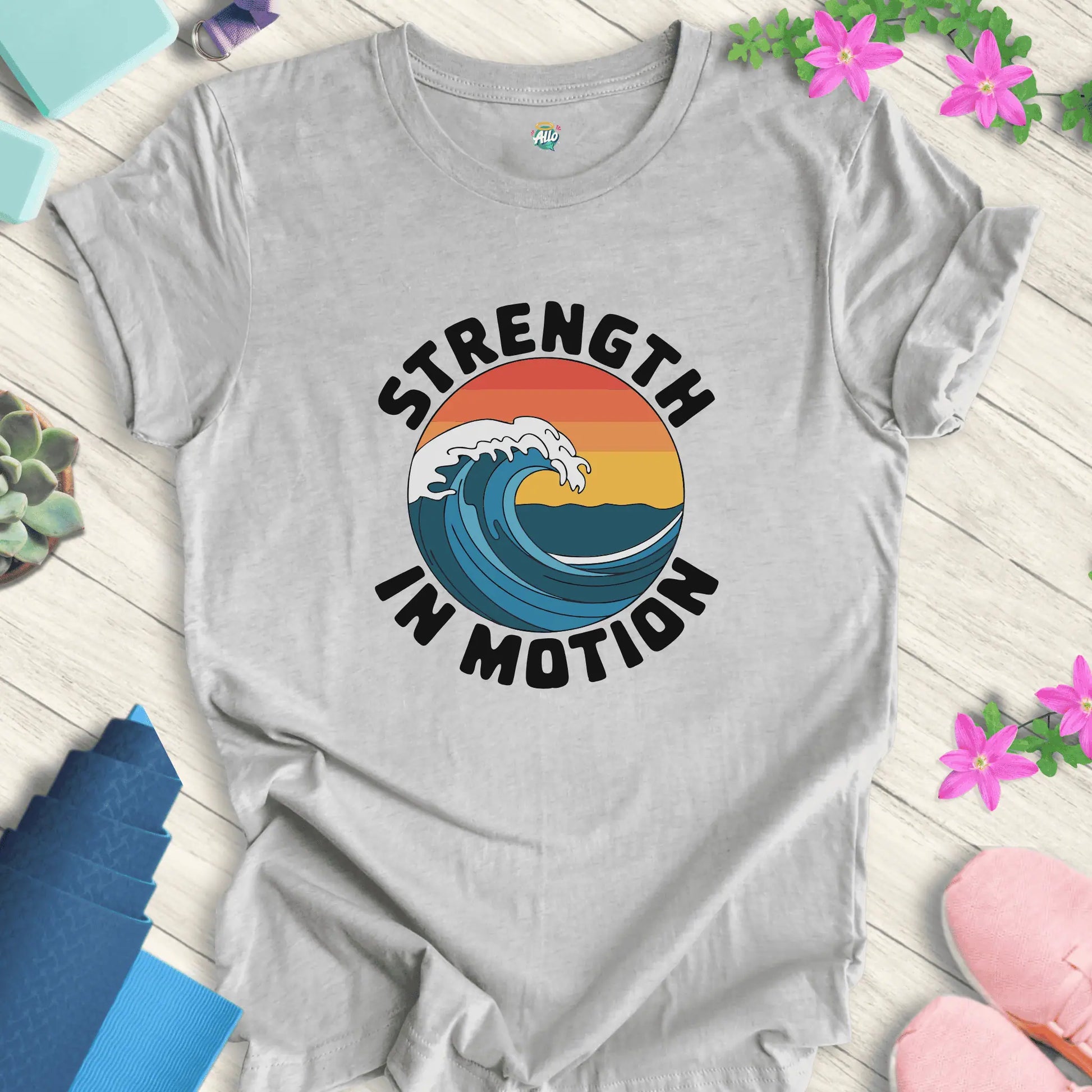 Athletic Heather yoga t-shirt with 'Strength In Motion' design by Halo Allo, featuring a wave graphic. Perfect for meditation and mindfulness.