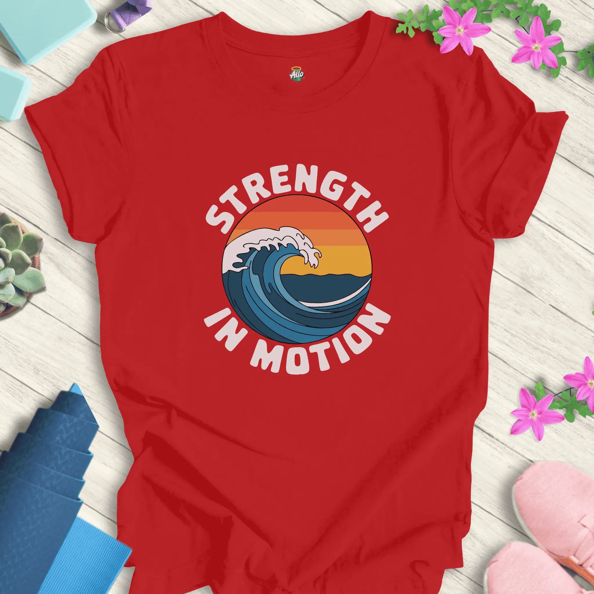 Red yoga t-shirt with 'Strength In Motion' design by Halo Allo, featuring a wave graphic. Perfect for meditation and mindfulness.